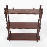 A late Victorian stained oak three tier hanging shelf,