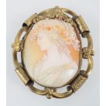 A large cameo brooch encased within a abstract gilt mount. Pin and sleeve fittings.