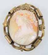 A large cameo brooch encased within a abstract gilt mount. Pin and sleeve fittings.