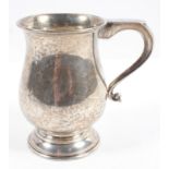 A silver 18th century style baluster mug with scroll handle, on domed foot, Birmingham 1973,