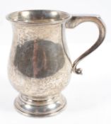 A silver 18th century style baluster mug with scroll handle, on domed foot, Birmingham 1973,