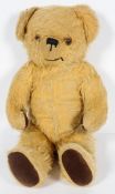 A Childsplay Toys, golden plush teddy bear with growler, fabric label,