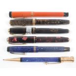 A collection of Parker fountain pens,