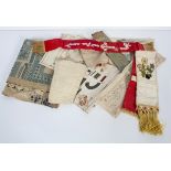 A collection of late 19th century embroidered bookmarks, a needlework Sampler mat,