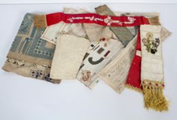 A collection of late 19th century embroidered bookmarks, a needlework Sampler mat,