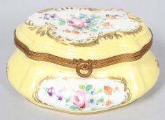 A French porcelain gilt metal mounted yellow ground bombe shaped box and cover, 20th century,