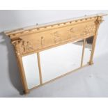 A Regency 19th century gilt and gesso moulded triple panel over mantle mirror