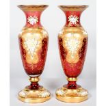 A pair of late 19th century Bohemian ruby glass vases,
