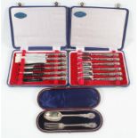 A cased silver Christening set of spoon and fork with shaped terminals and threaded foliate work,