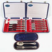 A cased silver Christening set of spoon and fork with shaped terminals and threaded foliate work,