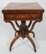 An Edwardian rosewood and inlaid envelope games table, with baize lined surface, coin hollows,