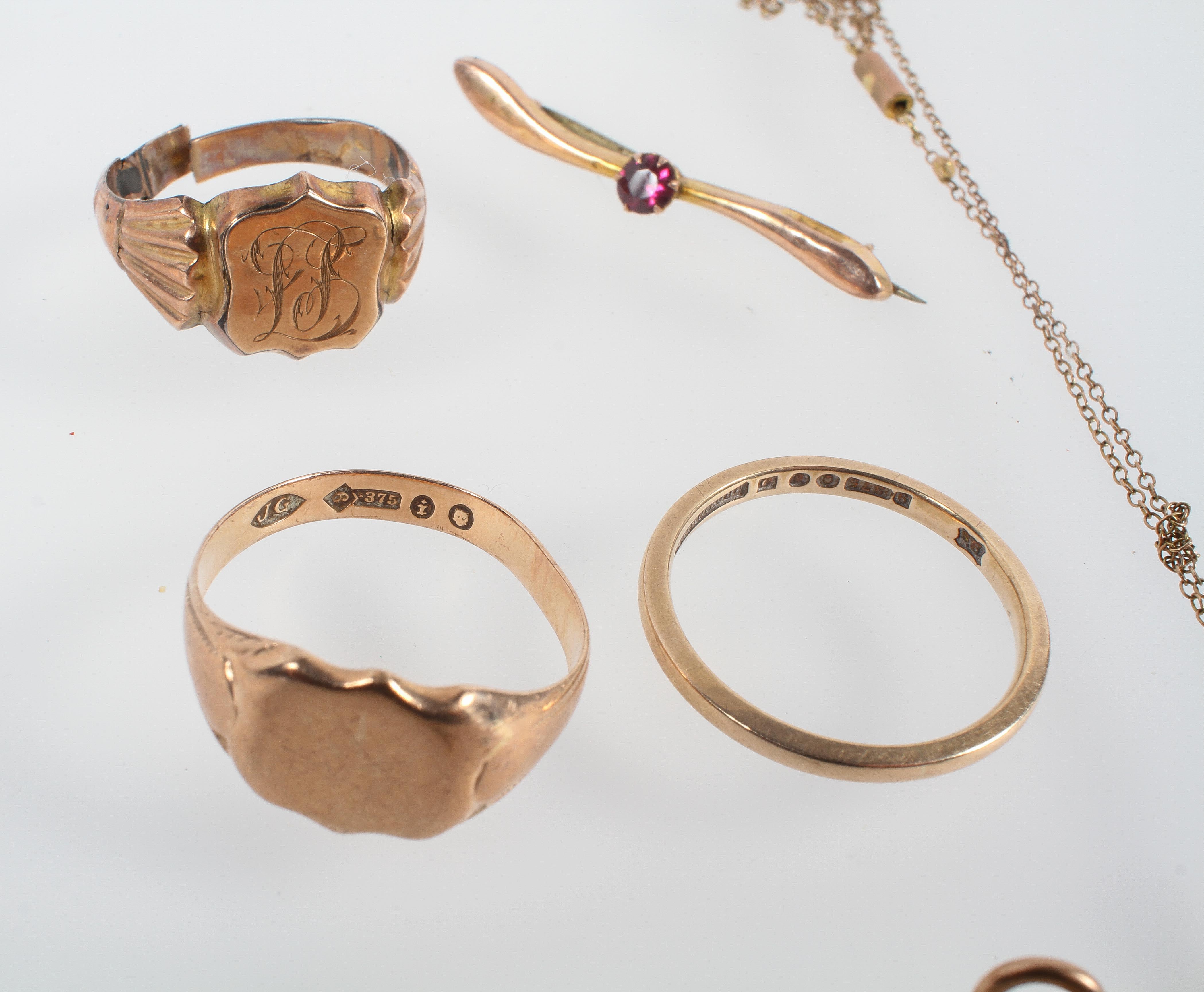 A collection of jewellery to include: Three rings; One brooch; Two pendants; One cross and chain. - Image 3 of 3