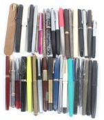 A large collection of fountain pens and accessories,