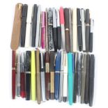 A large collection of fountain pens and accessories,