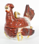 A French egg coddler, in the form of a hen and chicks,