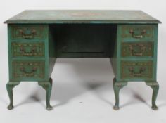 An Edwardian painted kneehole desk, early 20th century, with pedestal supports,