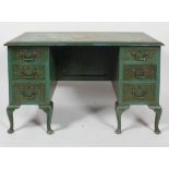 An Edwardian painted kneehole desk, early 20th century, with pedestal supports,