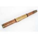 A brass and leather mounted single drawer telescope, the body engraved Cox, Devonport,