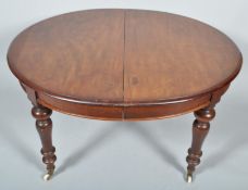 A Victorian mahogany extending dining table,