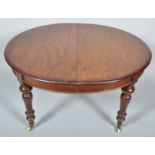 A Victorian mahogany extending dining table,