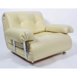 A 1970's vinyl armchair, with button upholstered back and seat,