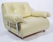 A 1970's vinyl armchair, with button upholstered back and seat,