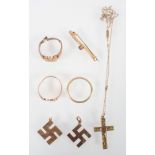 A collection of jewellery to include: Three rings; One brooch; Two pendants; One cross and chain.