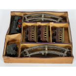 An early 20th century A W Gamage Ltd, '0' gauge clockwork train set, in original box,