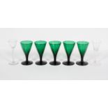 A set of five green-tinted wine glasses, 19th century,