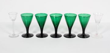 A set of five green-tinted wine glasses, 19th century,