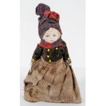 A bisque doll, probably French, the jointed body in 19th century costume,
