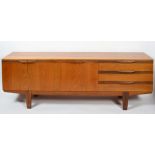 A mid century teak sideboard, fitted with an arrangement of three shallow drawers,