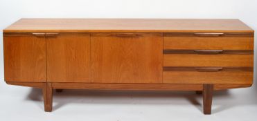 A mid century teak sideboard, fitted with an arrangement of three shallow drawers,