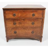 A 19th century oak three drawer chest, with three long graduated drawers,