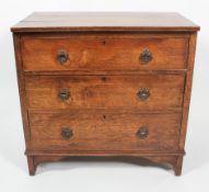 A 19th century oak three drawer chest, with three long graduated drawers,