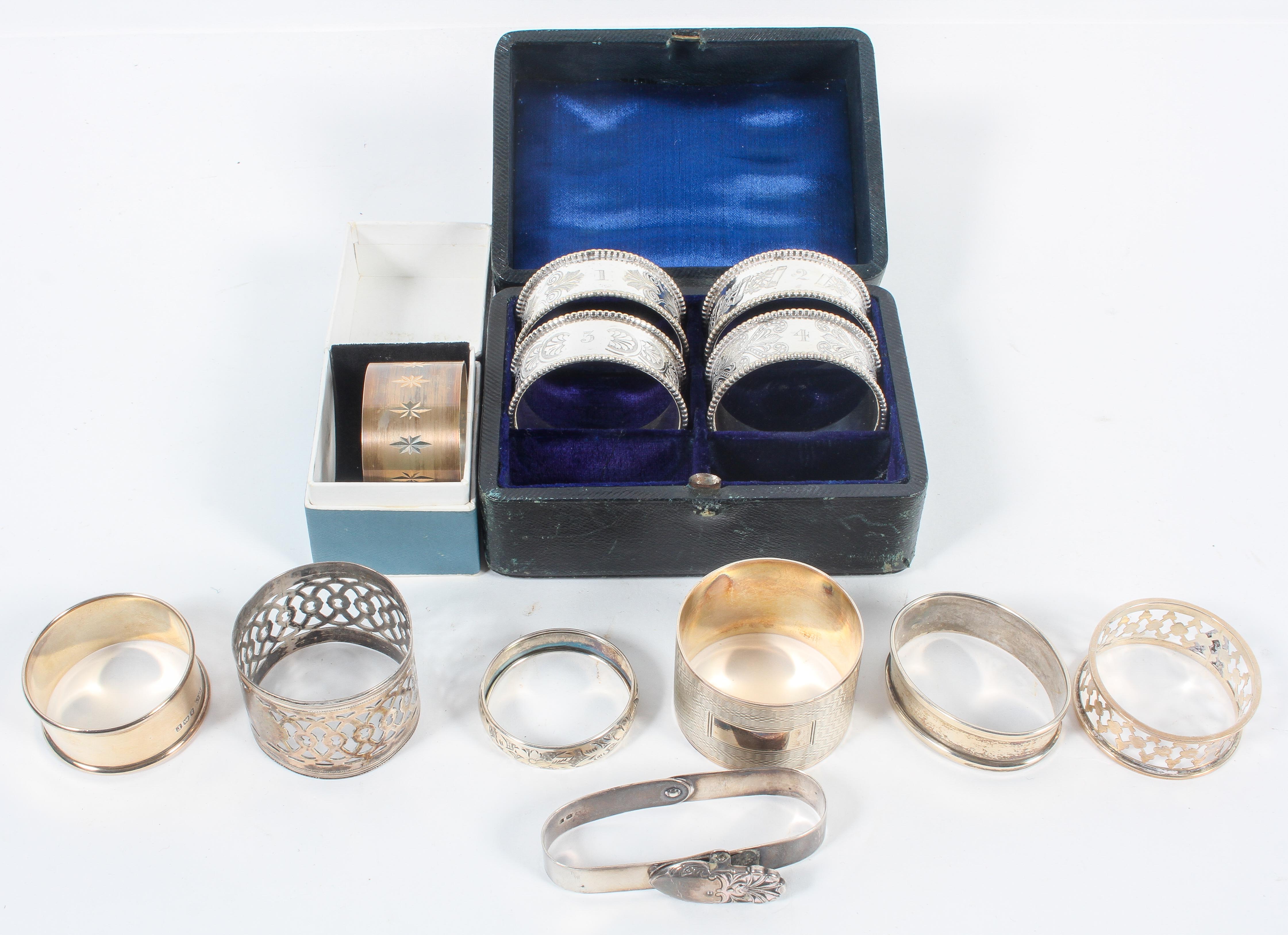 A collection of napkin rings, to include a Britannia Standard matted and bright cut example,