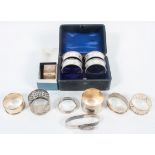 A collection of napkin rings, to include a Britannia Standard matted and bright cut example,