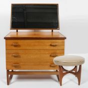 A G-plan Quadrille mid-century dressing table, with framed integral mirror above three long drawers,