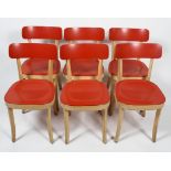 Six 'Basel' retro chairs, designed by Jasper Conran for Vitra, with red curved back rests and seats,