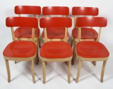 Six 'Basel' retro chairs, designed by Jasper Conran for Vitra, with red curved back rests and seats,