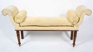 A George III style mahogany stool, scroll ends, upholstered in pale yellow chenille,