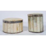 Two cylindrical mother of pearl and white metal mounted boxes and covers, with faceted sides,