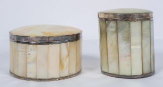 Two cylindrical mother of pearl and white metal mounted boxes and covers, with faceted sides,