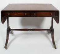 A Regency mahogany Pembroke table, early 19th century, with two frieze drawers within reeded edges,