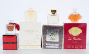 Four Lalique scent bottles, including Le Baisen,
