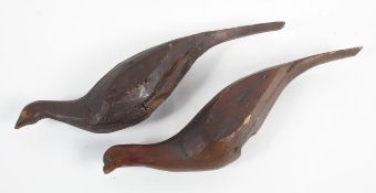 A pair of naive folk art carved pine figures of birds, probably 19th century, 'decoy pheasants', 57.