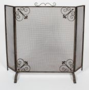 A triptych steel and iron fire screen, early 20th century,