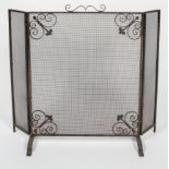 A triptych steel and iron fire screen, early 20th century,