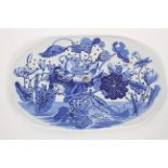 A Wedgwood pearlware drainer, early 19th century, transfer printed in blue with water lillies,