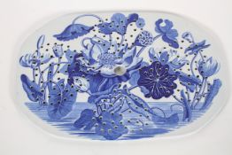 A Wedgwood pearlware drainer, early 19th century, transfer printed in blue with water lillies,